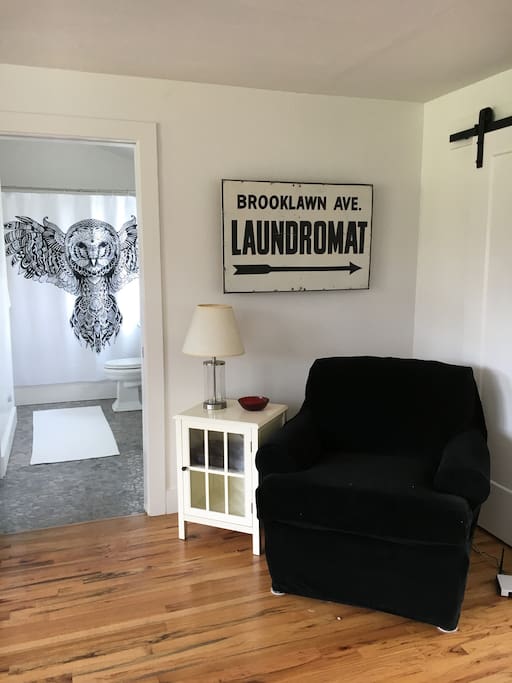 Hidden TV behind antique laundromat sign