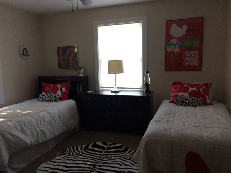 Two comfortable twin beds in 70's theme guest room upstairs