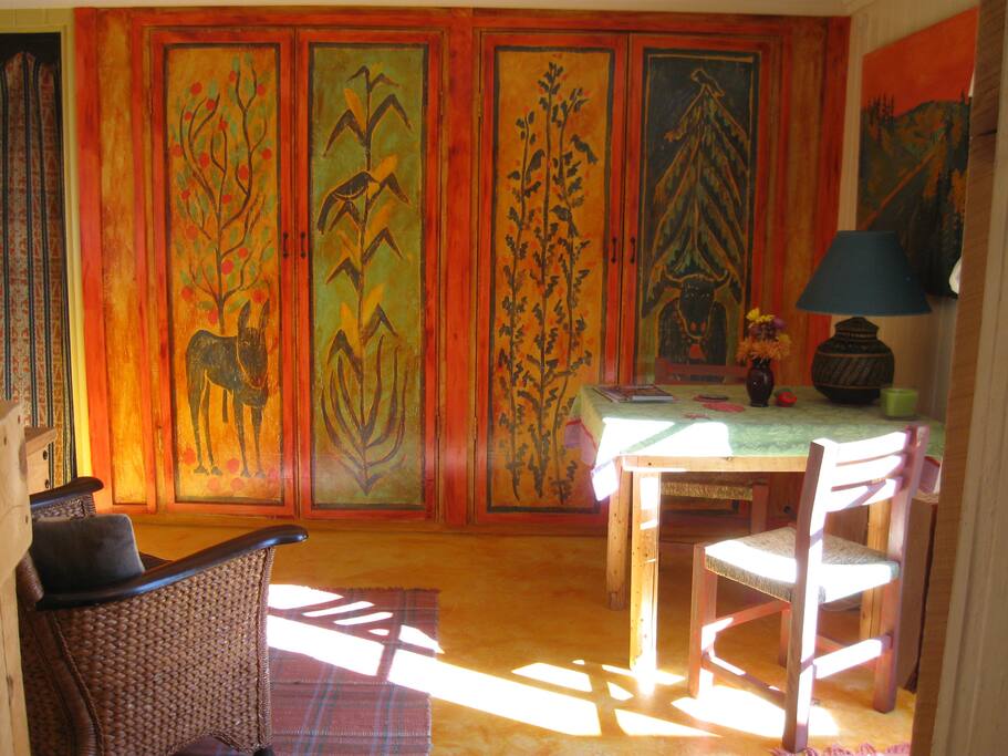 Kitchen items behind hand painted doors