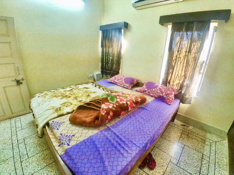 Dale(Room2) A soothing Passion Mango painted room comes with AC newly fitted AC. This room also comes with a Wardrobe and a safe. Its well lit with two garden view
