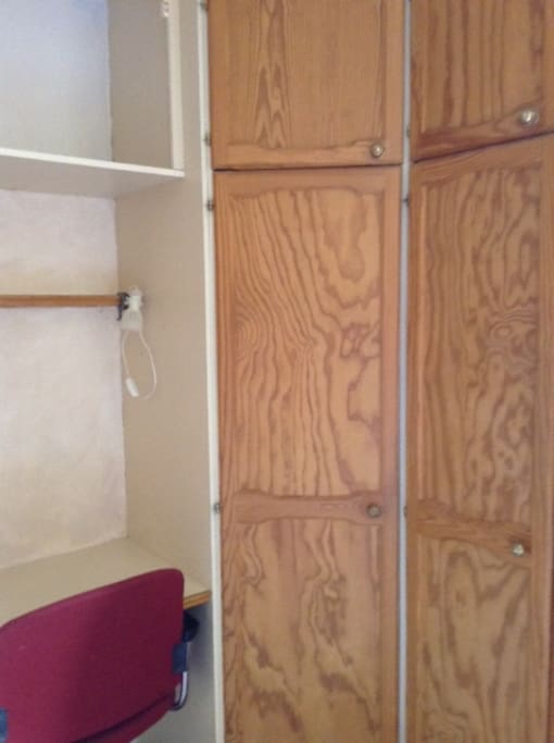 fitted wardrobe and desk area