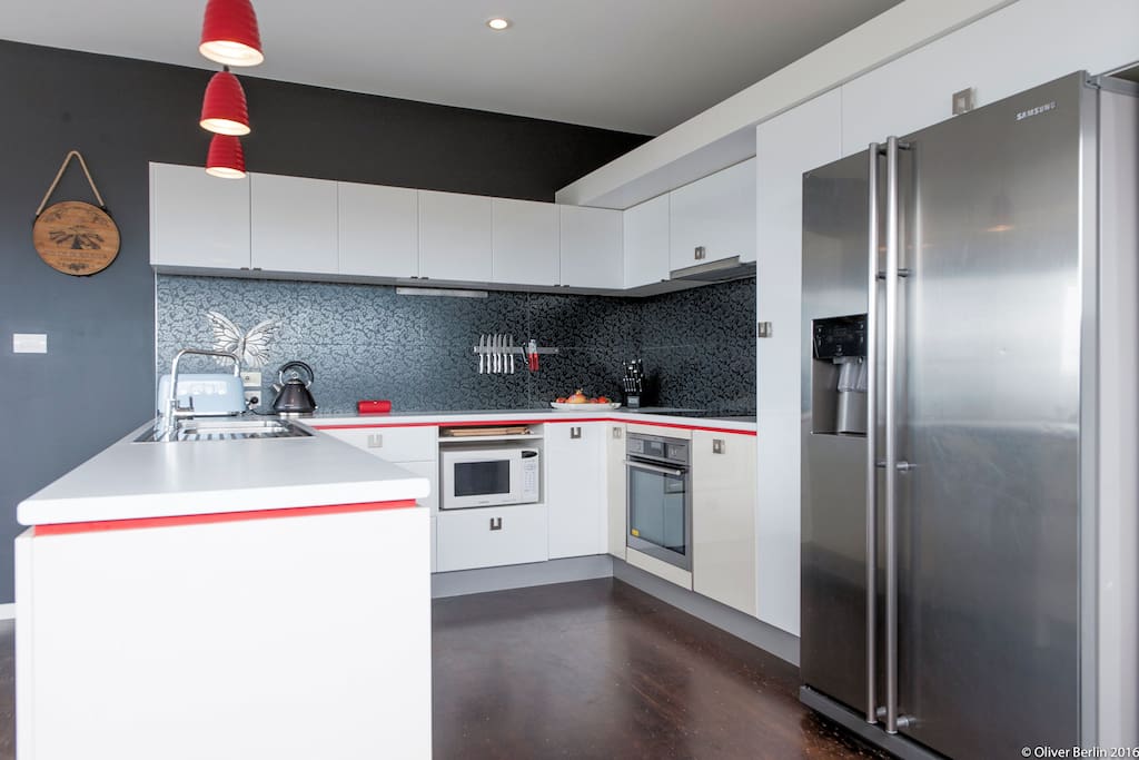 Designer kitchen with AEG oven, induction stove, dishwasher, icemaker fridge...