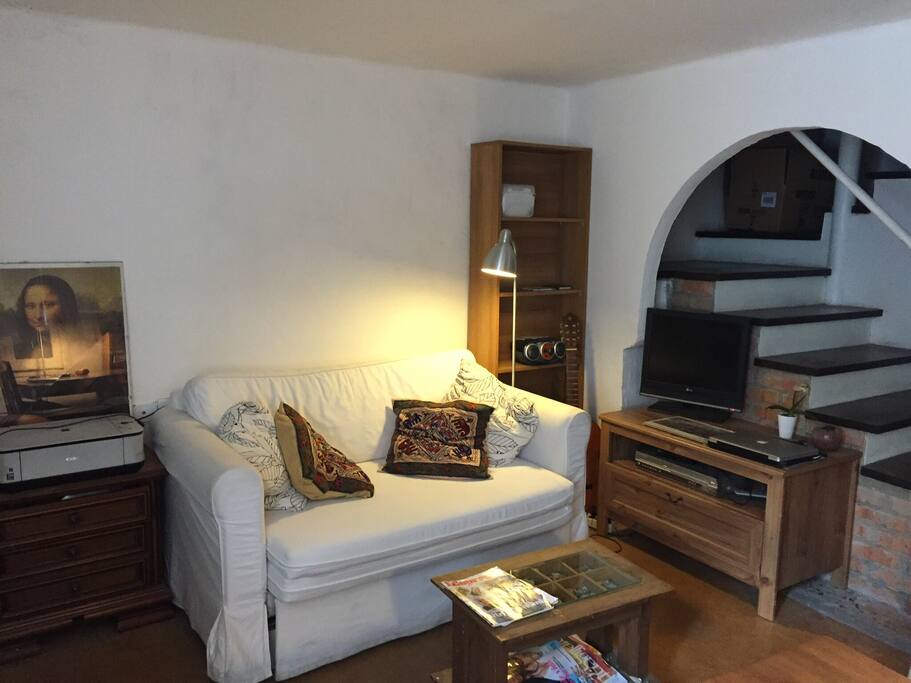 The sofa could became a double bed. Tv, DVD player, printer, radio.