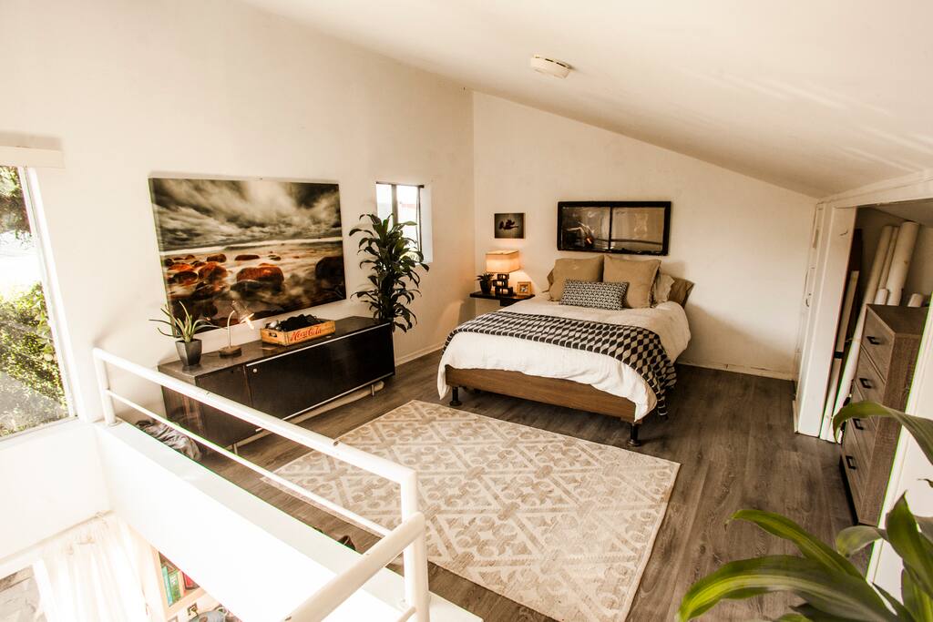 Queen size bed with memory foam topper and dresser for clothing storage.