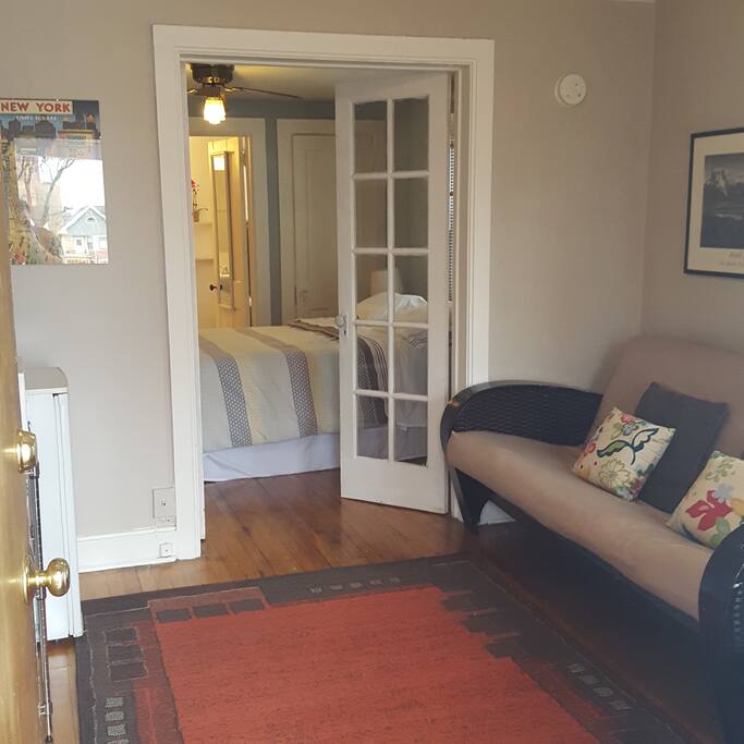 Beautiful french doors separate living from sleeping space