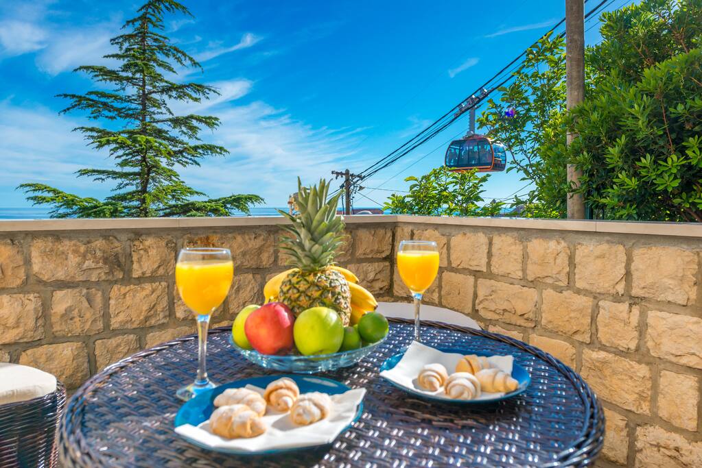 Welcome to Villa Magnolia, in this two-bedroom apartment our guests can relax on spacious terrace sourrounded with mediterranean garden equipped with dining table and lounge furniture boosting spectacular sea view over Adriatic Sea, Lokrum Island and UNESCO protected Dubrovnik Old Town.