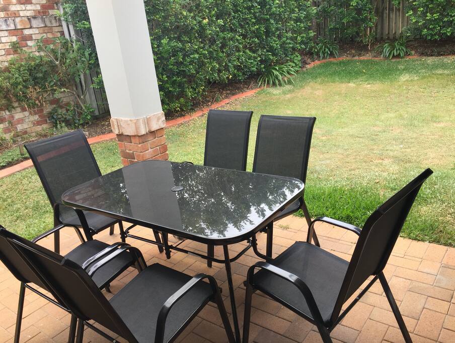 Outdoor entertainment area with BBQ and outdoor relaxation swing