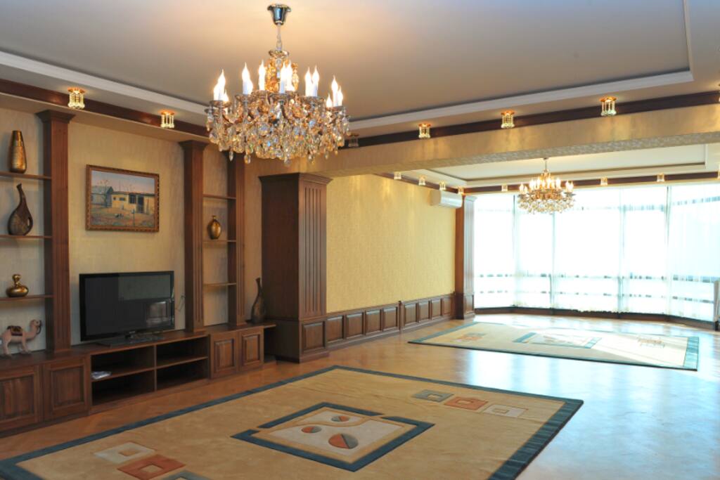 Living room (old photo). Now we have 2 sofas, 1 armchair, huge dining table and 10 chairs in this room.