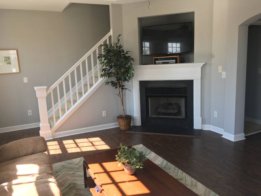 TV with Netflix, DVD player, and VCR player. Gas fireplace. Stairs to bedrooms on top floor.