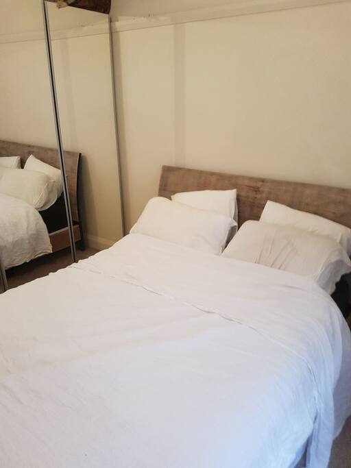 Comfy bed with linen sheets