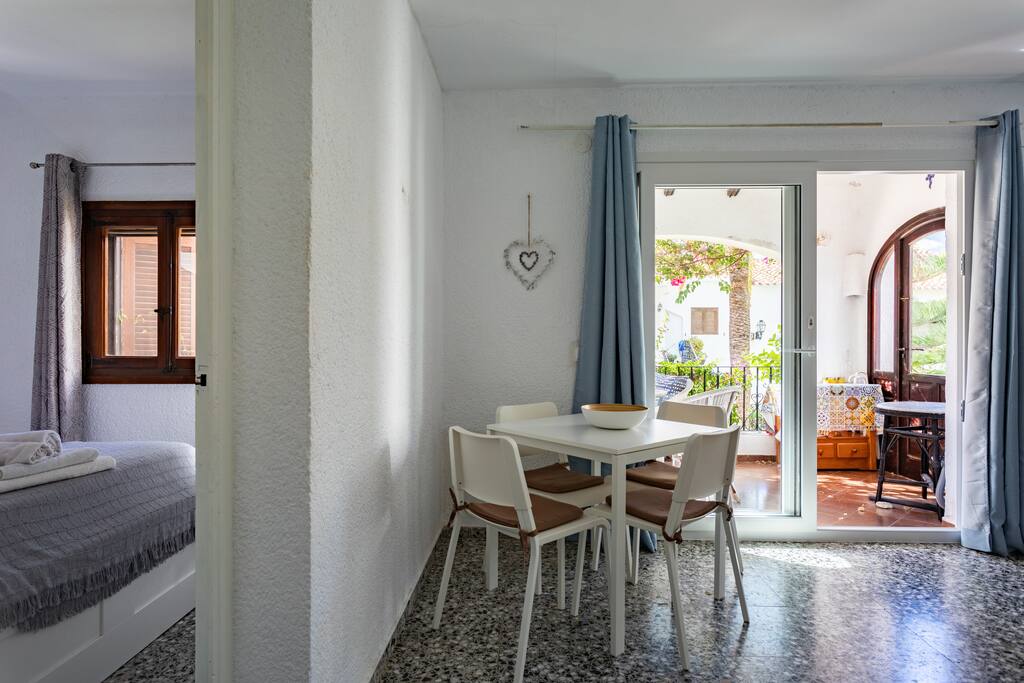 Dining area and bedroom 1.