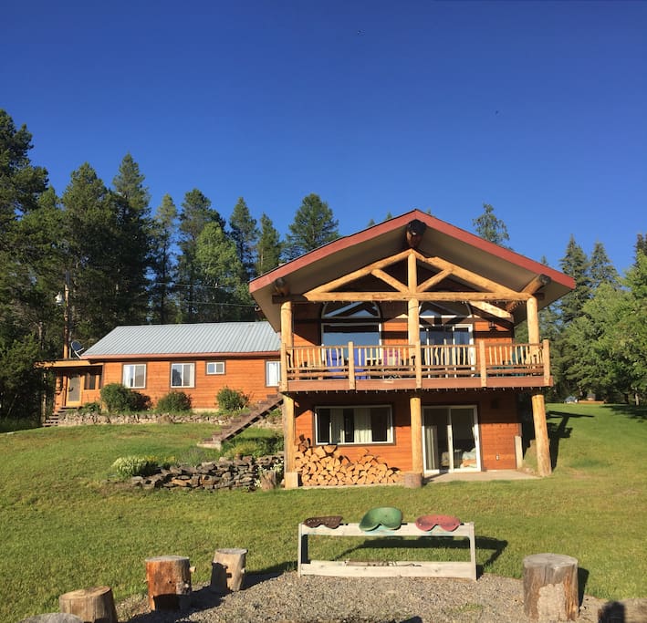 Perched on high ground with a commanding view across meadows to the mountains.