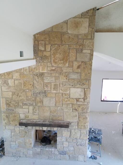 The Hearth Room (lobby) fireplace int he Blue Vista Stone Lodge gives the building its name. The stone is from our site.