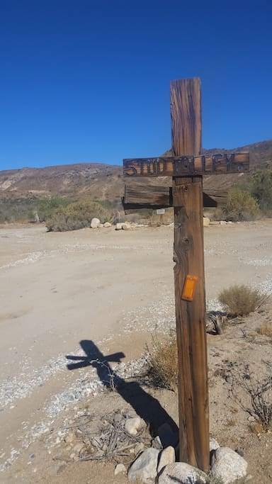 A hard right at this sign, then follow a dirt road to the end