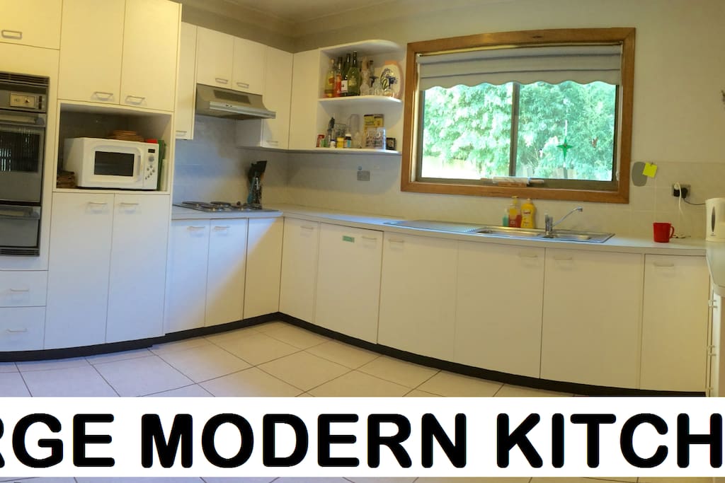 Large spacious kitchen area with electric stove, microwave, kettle, toaster and appliances. We provide bread and a range of cereals so you can have a light breakfast of Toast and/or cereal if you like each morning as well as tea and coffee.