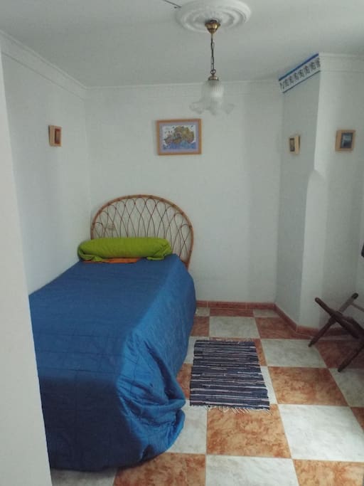 The bedroom with the main bed showing; the other bed is underneath.