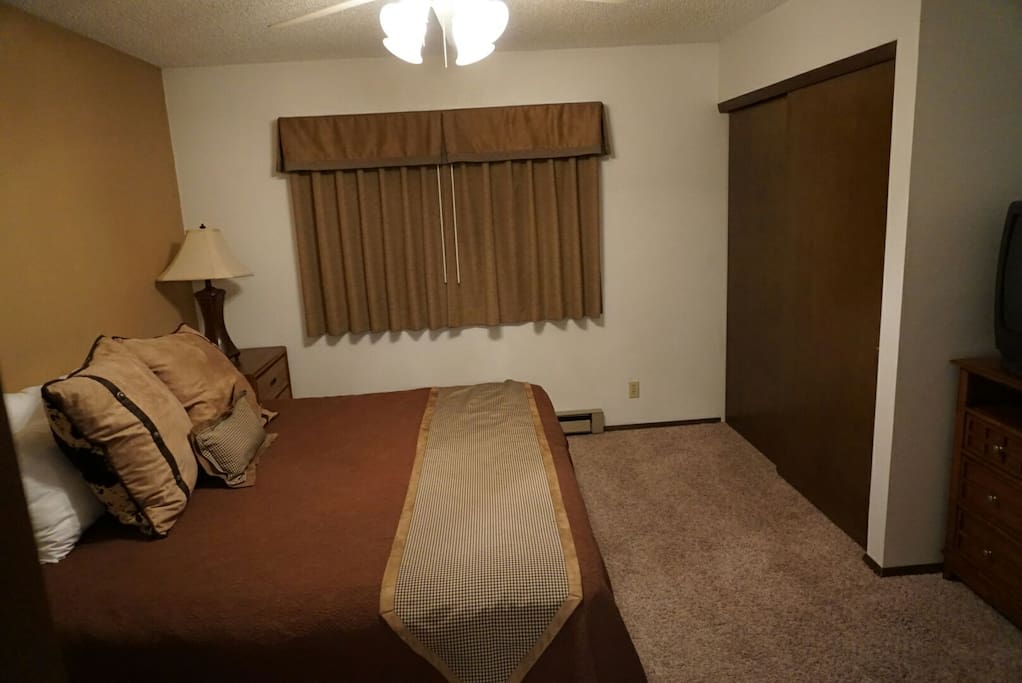 Master bedroom - king bed with TV, lathe closet, and private bath.