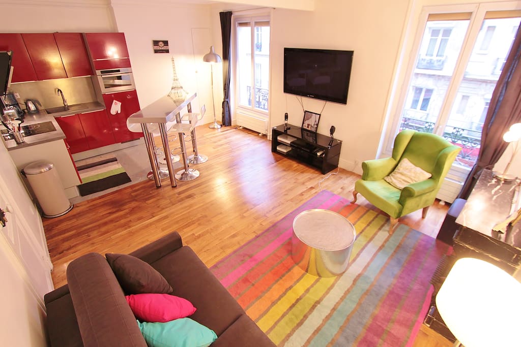 Living room with large sofa bed and TV