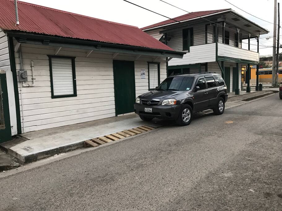 The one story building (left) is the convenience store located on the same property. The lower flat of the two-story building (right) is the clothing store. The Upper Flat is the home.