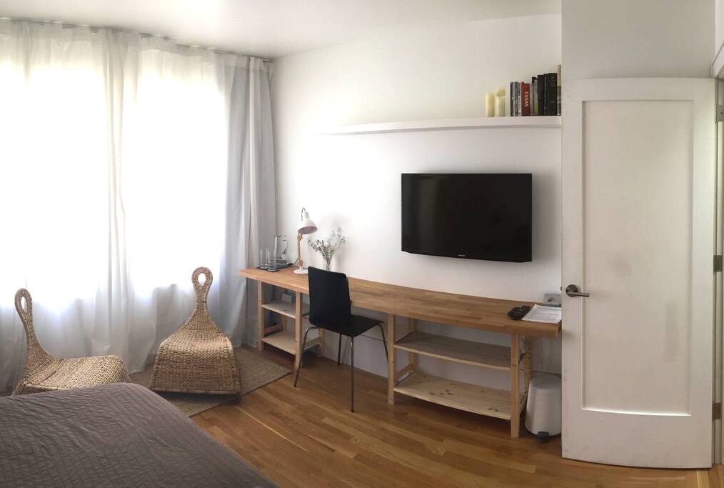 Workspace, hang out area, and TV with movies and streaming services and broadcast channels