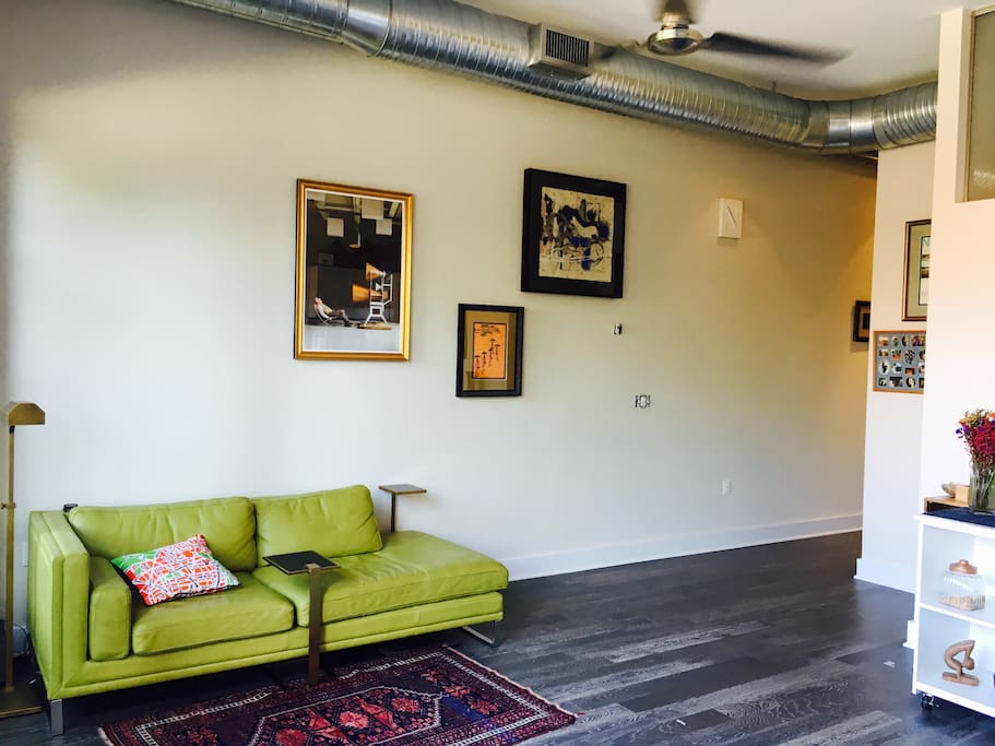Modern, industrial loft with a super long couch that sleeps one — comfortably.