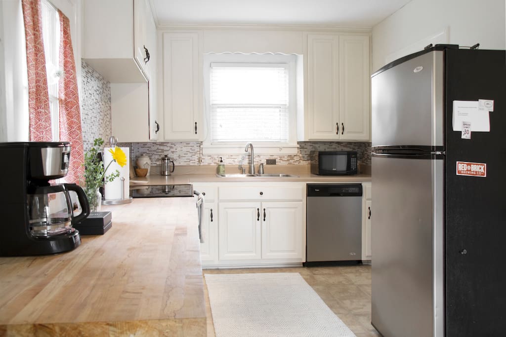 Kitchen equipped to handle all cooking needs and Whirlpool stainless appliances.