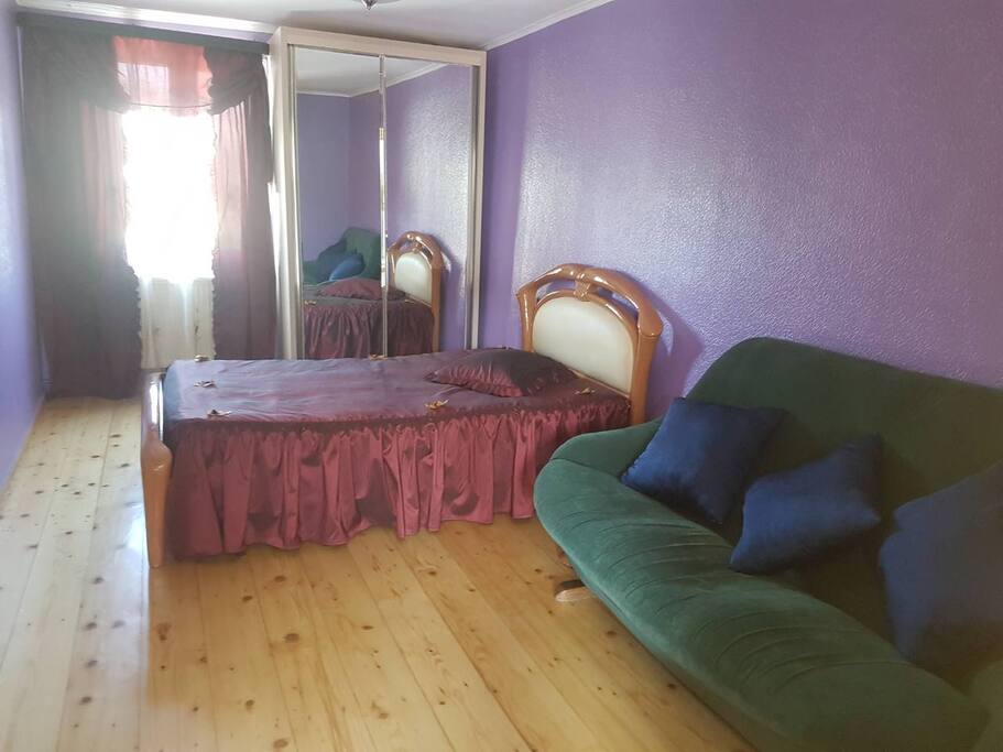 Second Bedroom with bed and sofa