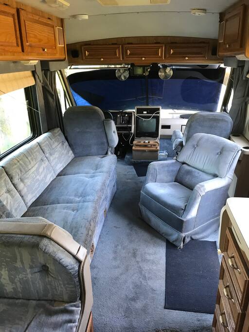 Front of RV with a couch and chairs