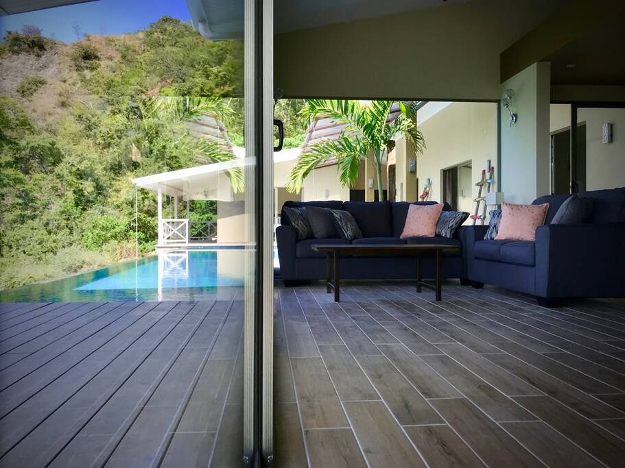 Living room next to pool area