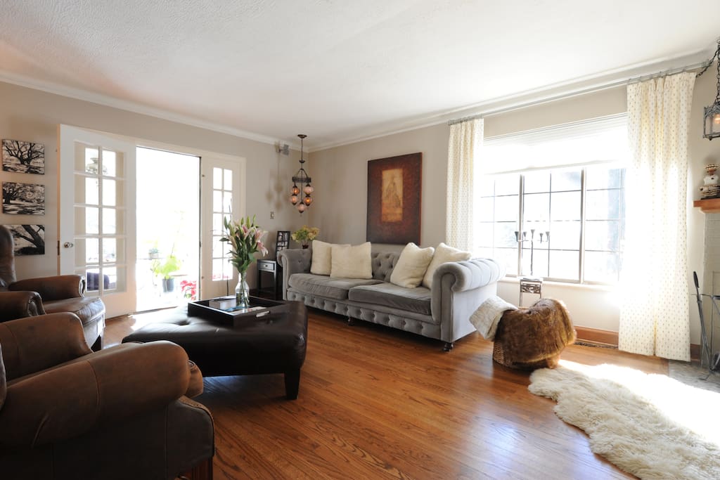 Comfortable seating in the living room gives way to the sunroom and back patio.
