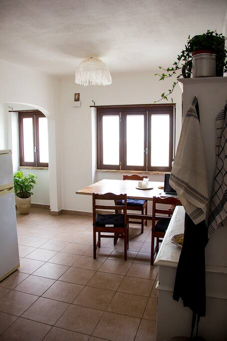Kitchen with big dining table. Space to work with laptop