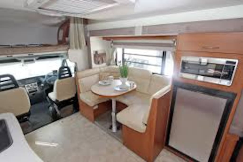 This motor home is a "slide out" model making it quite spacious and well venitilated with lots of louvred windows.