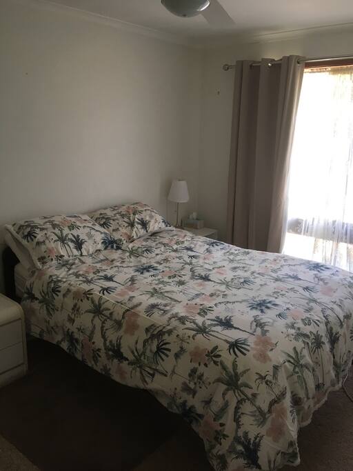 Master bedroom with queen size bed and mattress