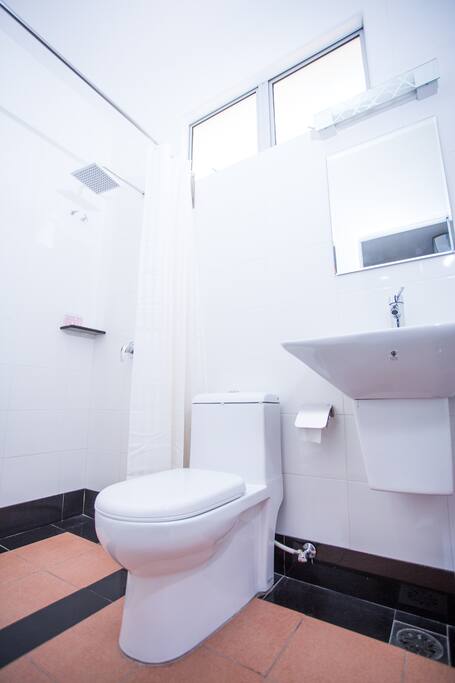 Individual bathroom in room .Pressurized hot & cold water with rain shower
