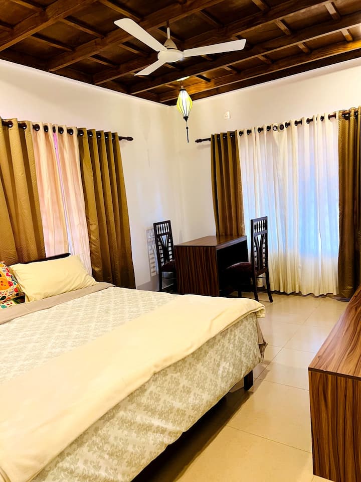 Spacious bedroom with beds and pull out beds under them