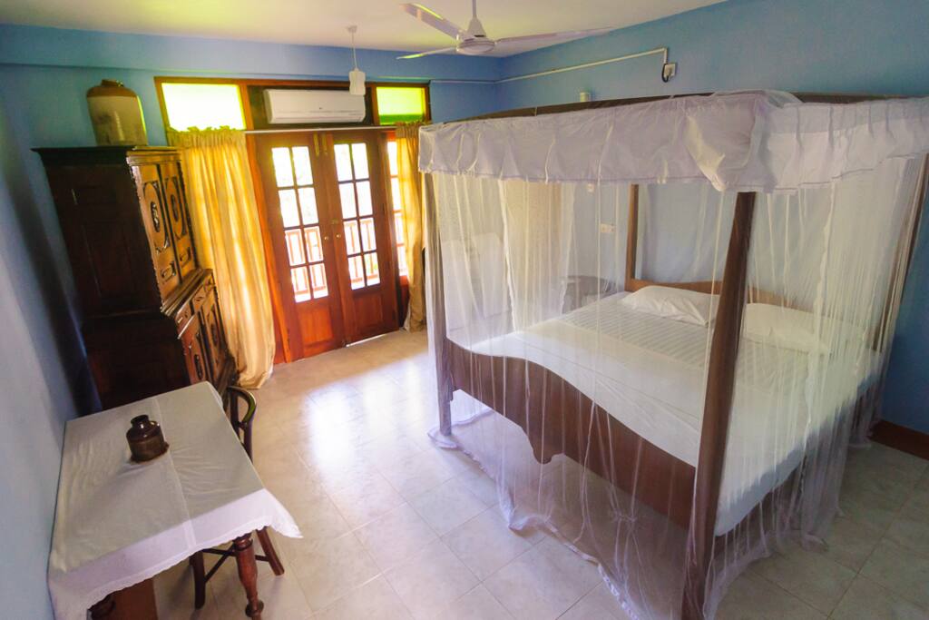 bedroom with AC and ensuite bathroom