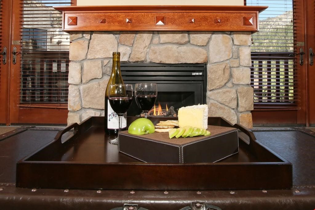 Feel right at home in the living area featuring a stone-fronted gas fireplace!