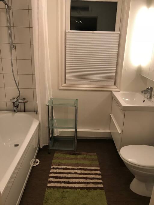 private bathroom shower, bathtub, sink and toilet
