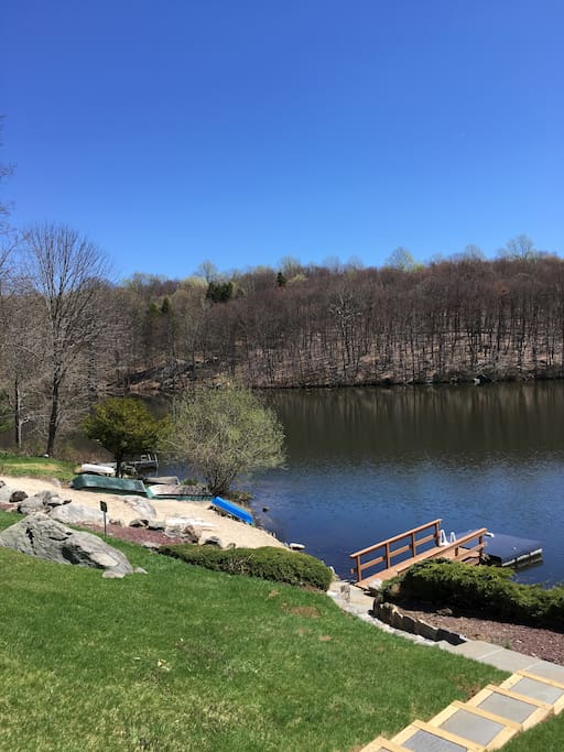Private sandy beach and dock includes four boats for your enjoyment