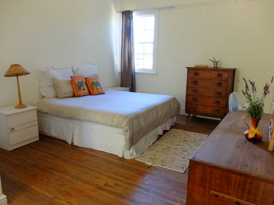 Garden Cottage Double room with a king size bed can easily be made into a twin. It has beautiful wooden floors and hanging space for clothes