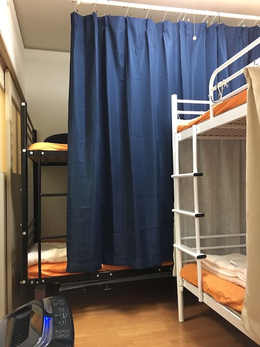 The bunk beds have partitions to keep your good sleep. The room also has air cleaner.