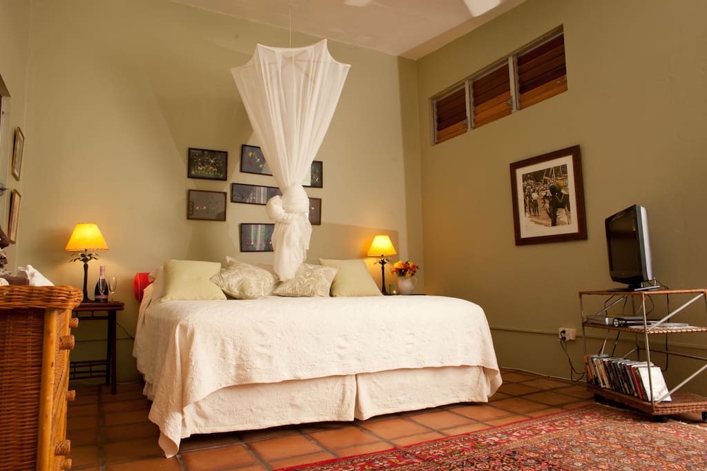 Bedroom 1 - with king size bed, tv, sofa, desk and walk out to gallery through french doors. AC available at extra cost.