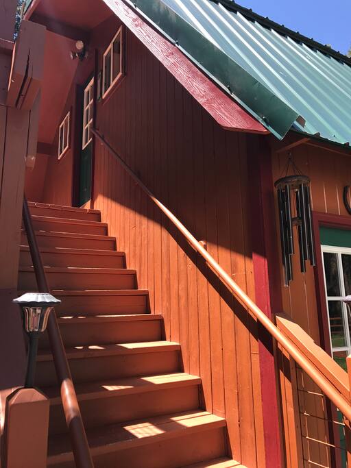 The stairs up to the private deck & guest apartment.