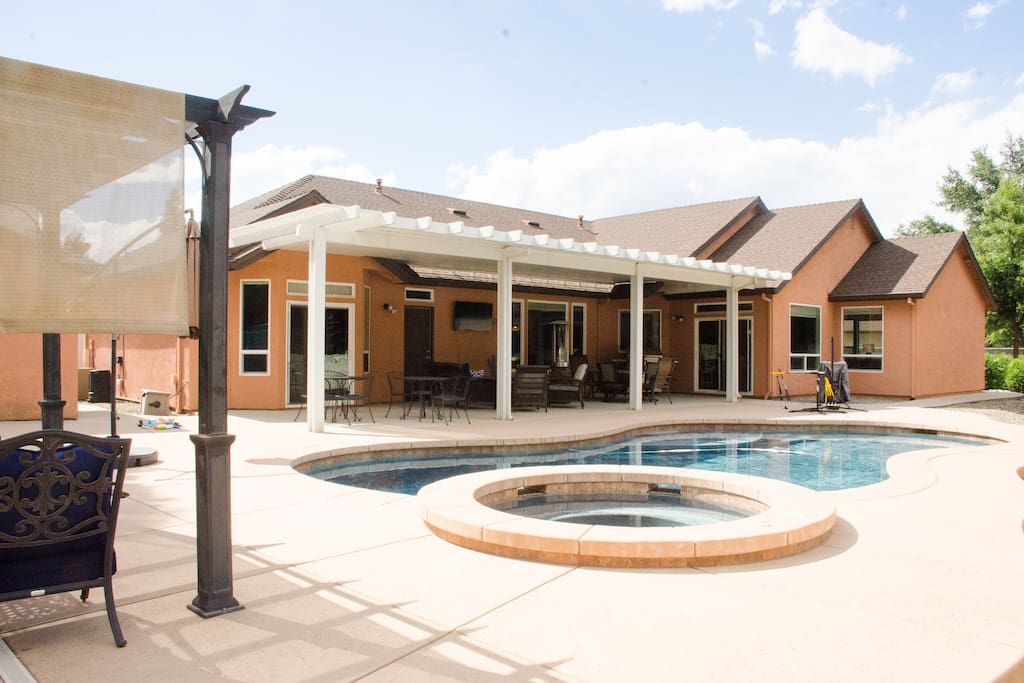 Tons of shaded patio with furniture