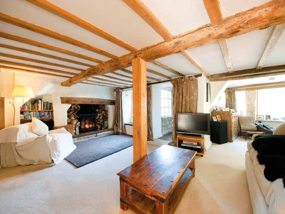 Original beams in the sitting room with Inglenook fireplace