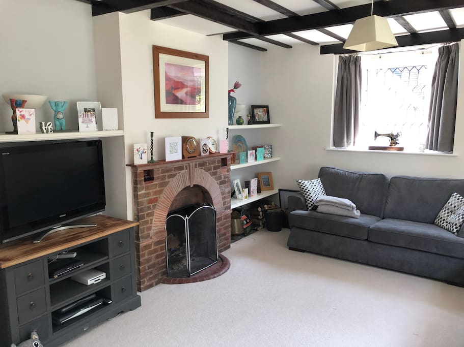 Living Room with beamed ceiling and open fire