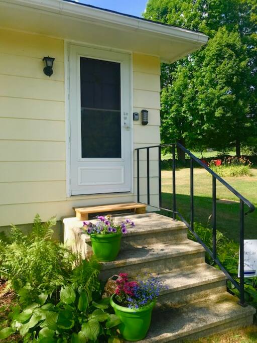 Private entrance with ample parking right outside your door. Sturdy hand rails and cement steps.