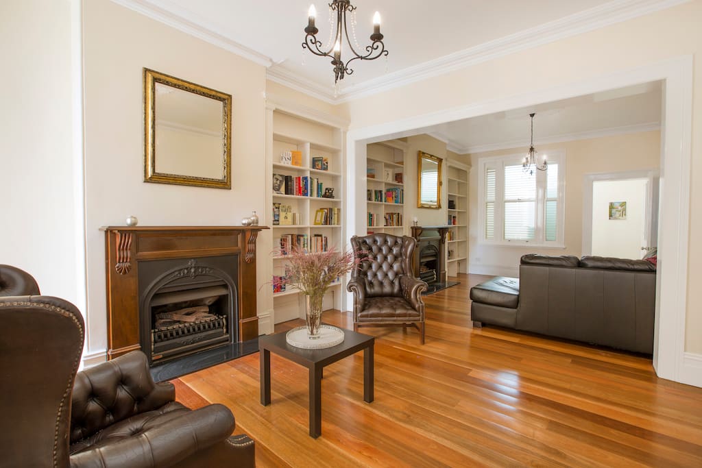 Classic style & character. Vintage Chesterfield leather lounge chairs, library and ornate decorative fireplaces