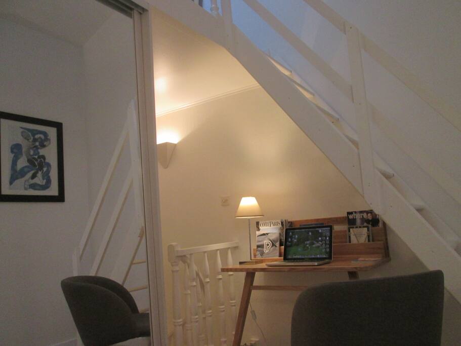 On the first floor, the cute little desk waiting for your computer!
