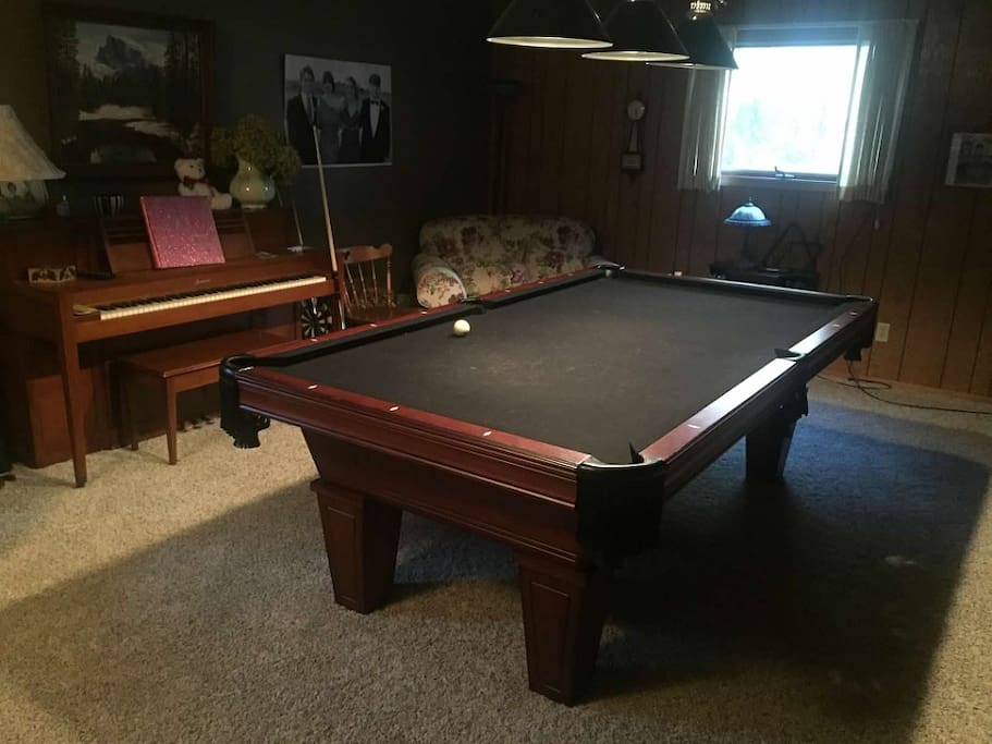 Game room offers a full size slate pool table that has a ping pong table that can go over the top of it. Stereo and cable tv also available in game room.